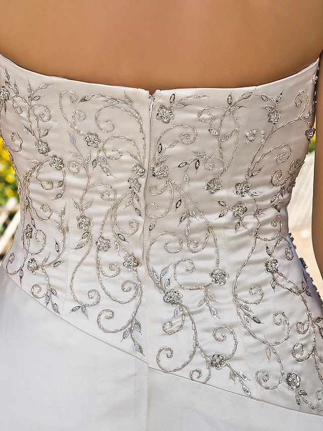 Elegant A-line strapless satin wedding dress with chapel train.