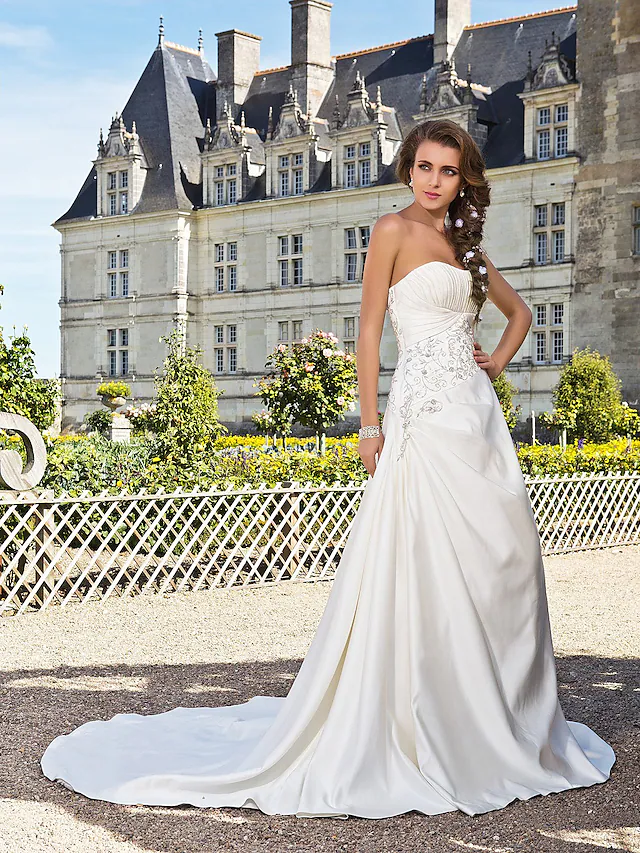 Elegant A-line strapless satin wedding dress with chapel train.