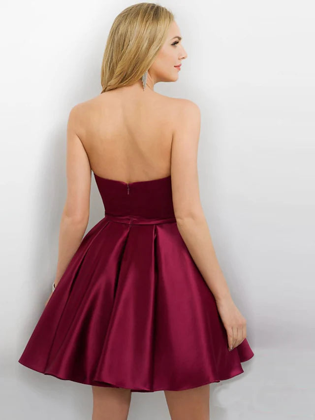 Side view of model wearing a short A-line satin party dress.