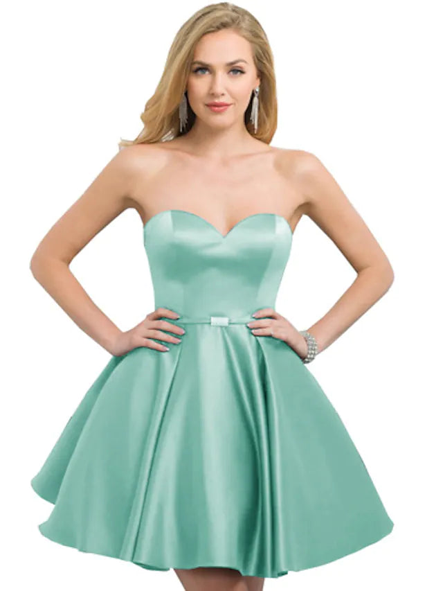 Close-up of the A-line strapless satin dress fabric and drape.