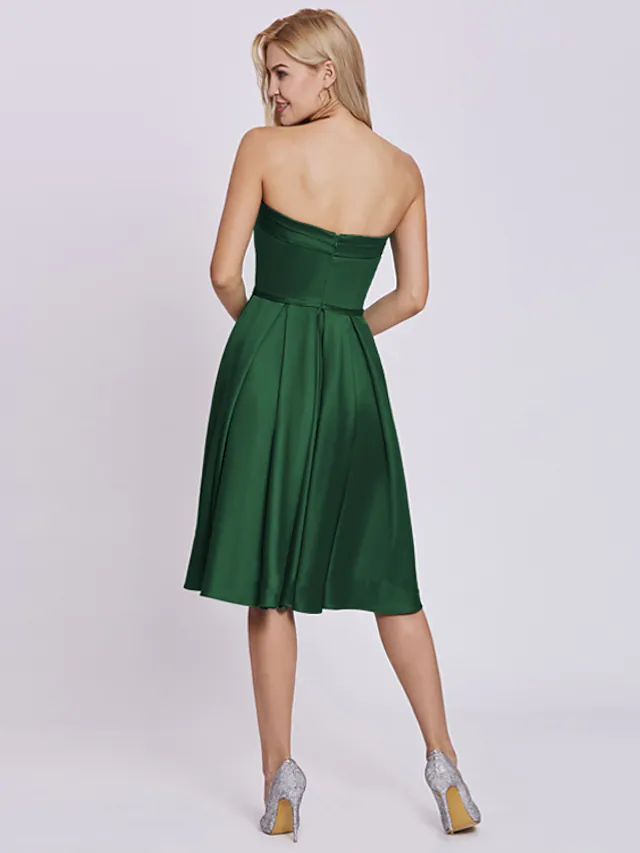 Back view of the knee-length satin party dress.