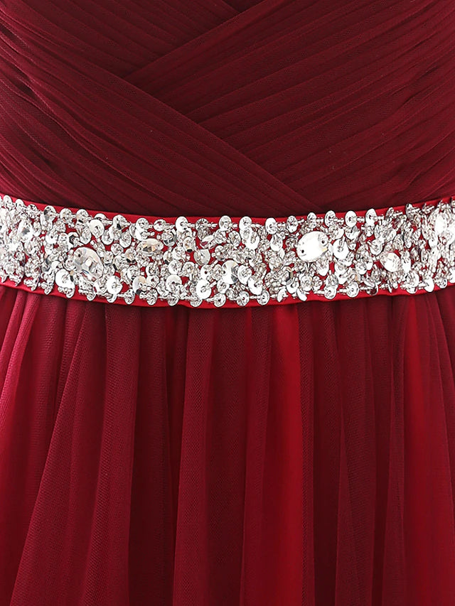 Side view of the A-line dress showcasing the chapel train and satin fabric.