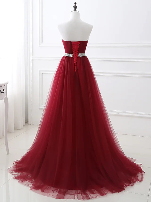 Another angle of the A-line satin dress with crystal details.