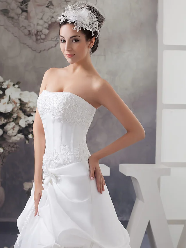 Side view of A-Line wedding gown with elegant silhouette.