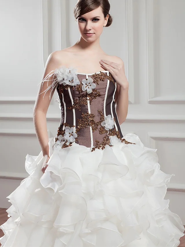Close-up of the bodice of the A-Line wedding dress, showing lace and beading appliques.