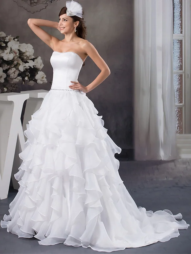 Back view of A-line strapless wedding dress showing court train.