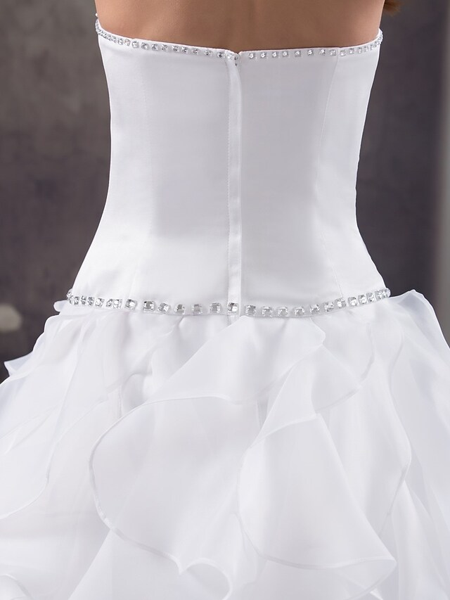 Full length view of strapless wedding dress with court train.