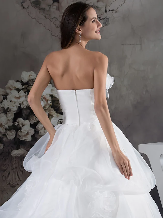 Full length view of strapless A-Line wedding dress with chapel train.