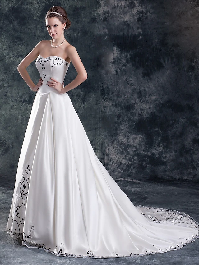 Back view of A-Line wedding dress showing court train and embroidery.