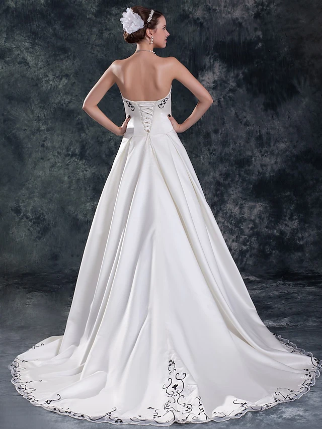 Close-up of embroidered details on the bodice of the wedding dress.