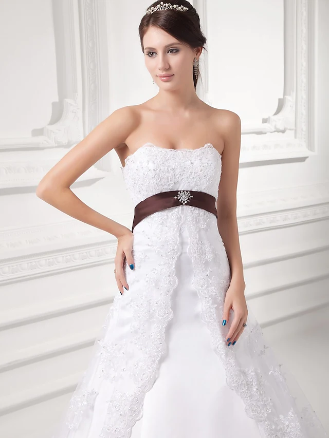 Full length view of A-Line wedding dress with sashes and ribbons.