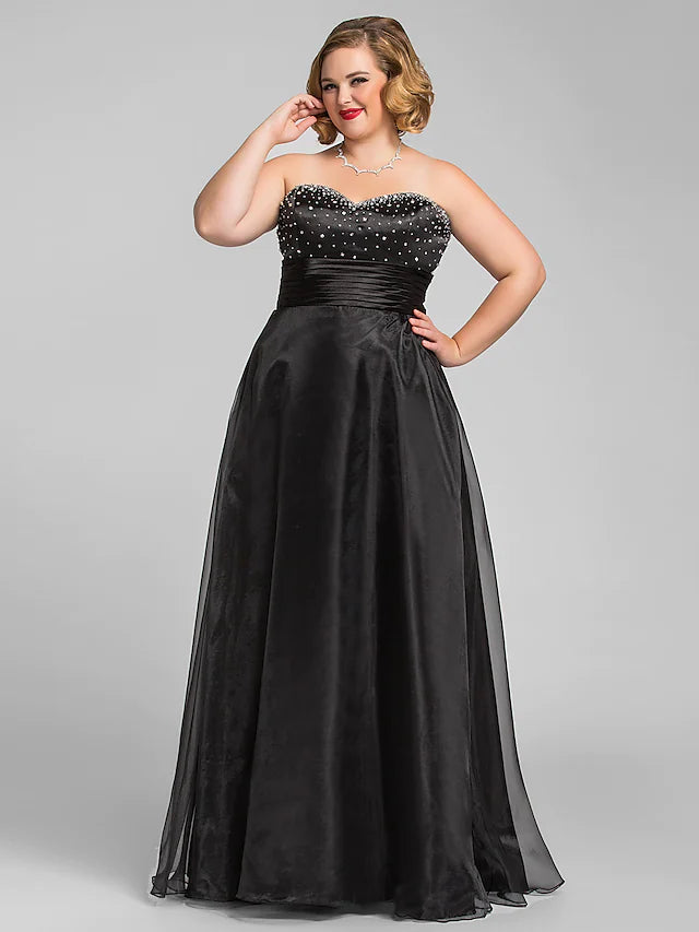 Elegant A-line black organza prom dress with sweetheart neckline and ruched bodice.