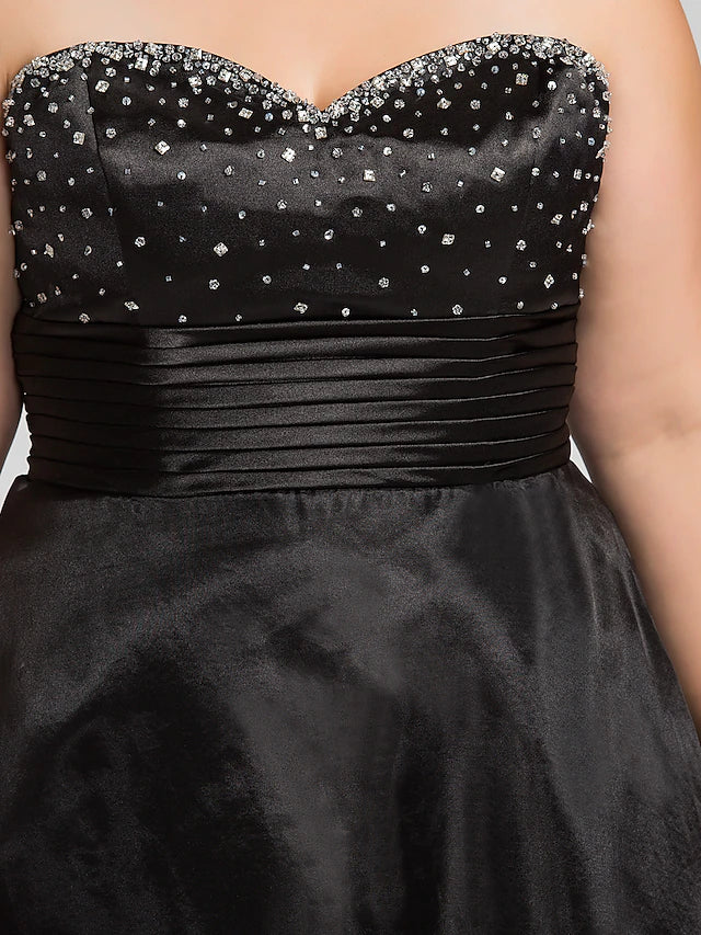 Back view of the sleeveless black prom dress, showcasing the flowing organza skirt.