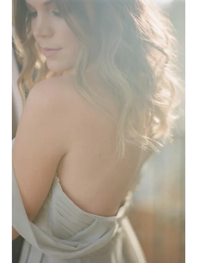 Close-up of the sweetheart neckline and pleated detail on a chiffon dress.