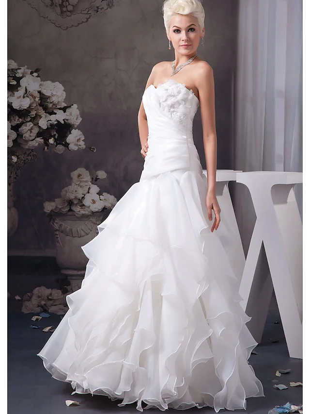 Back view of A-Line wedding dress with ruched appliques.
