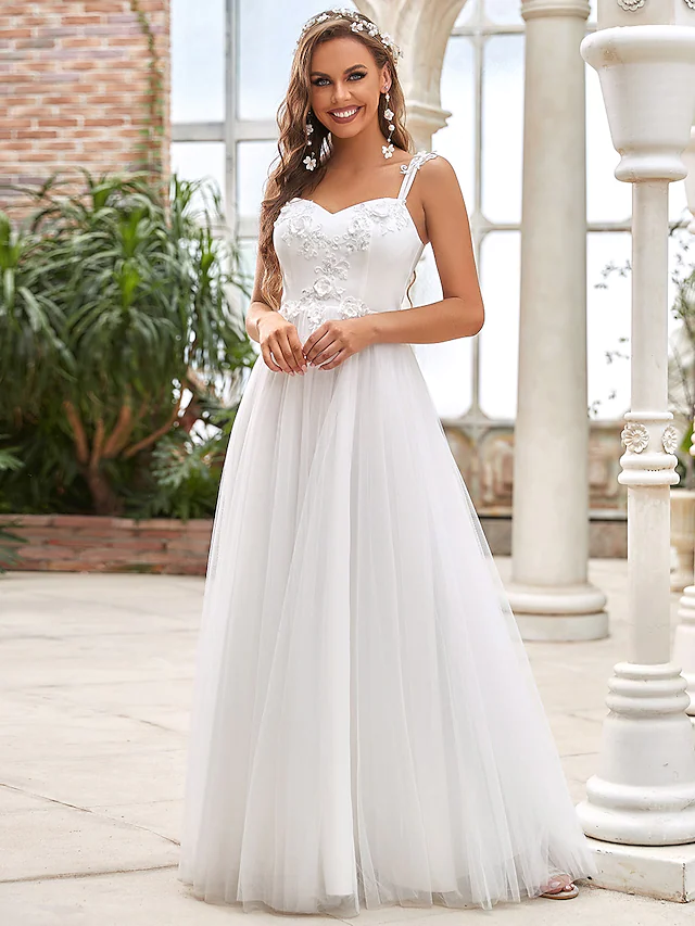 Elegant A-Line wedding gown with sweetheart neckline and lace appliques.