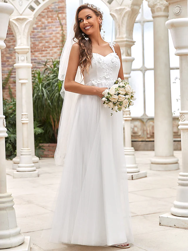 Back view of a floor-length A-Line wedding dress with delicate lace details.