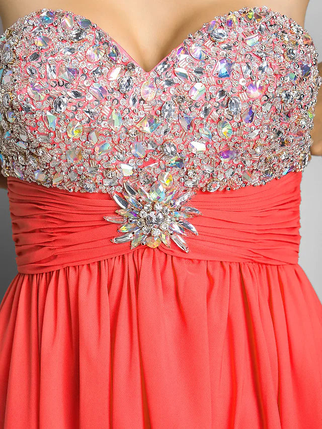 Close-up of crystal beading and ruched fabric on a sweetheart dress.
