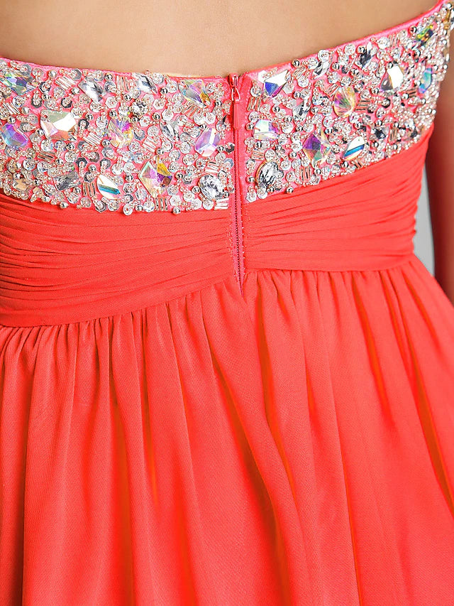 Model wearing a short A-line dress, showcasing the flowy chiffon skirt.