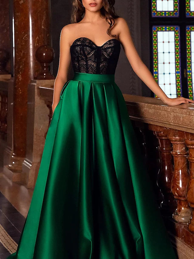 Back view of the A-line satin gown, showcasing the court train and flowing silhouette.