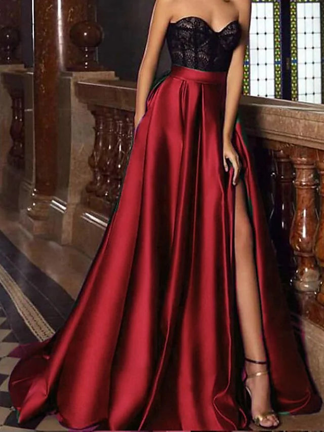 Full length view of the A-line satin gown, showing the elegant drape and court train.
