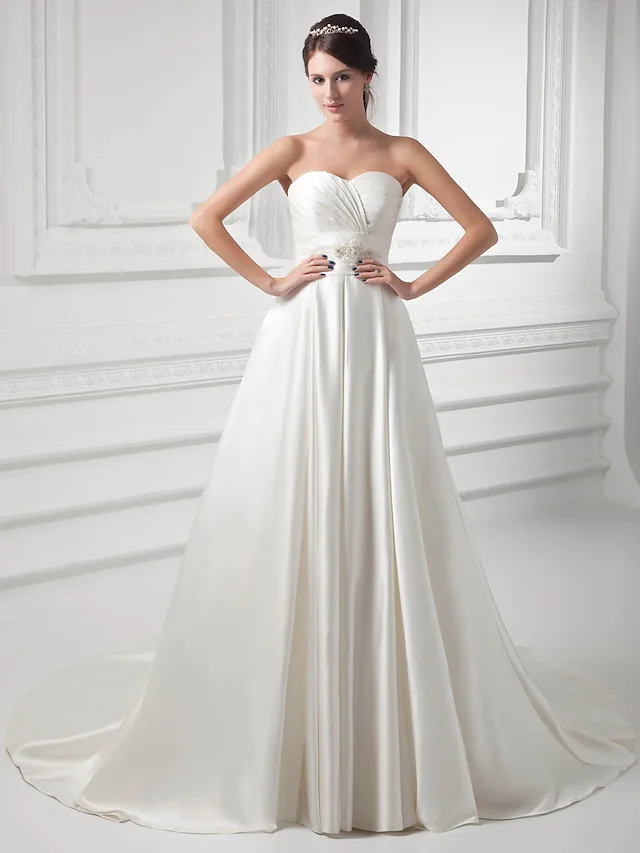 Elegant A-Line wedding dress with sweetheart neckline and court train.