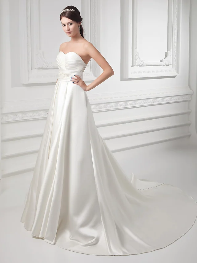 Back view of A-Line satin wedding dress with button details.