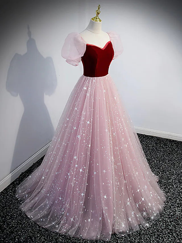 Back view of an A-line sequin tulle prom dress.