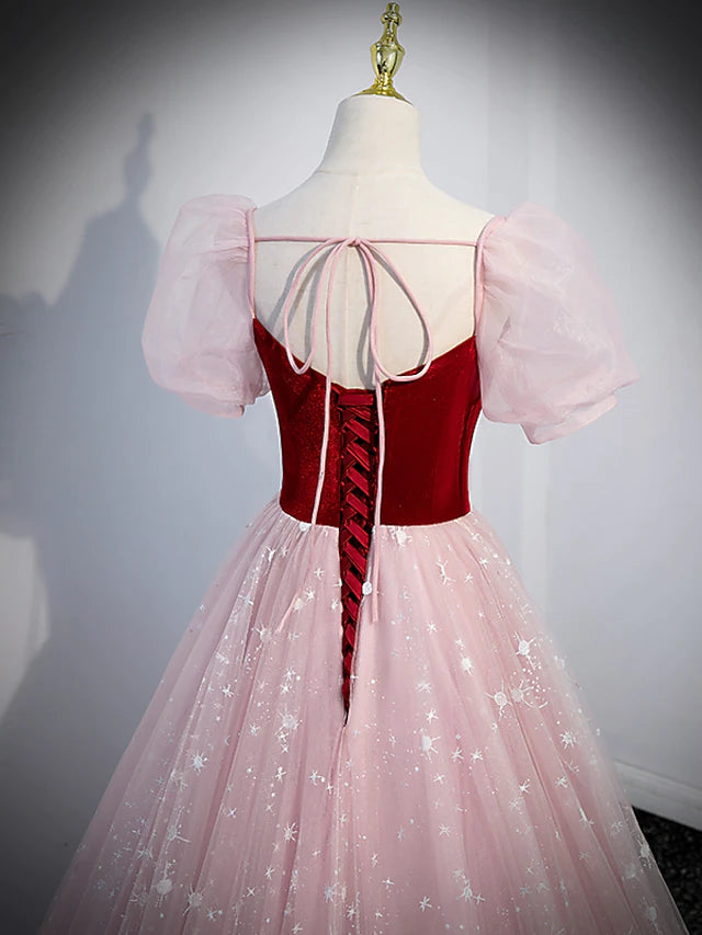 Side view of a floor-length A-line prom dress.