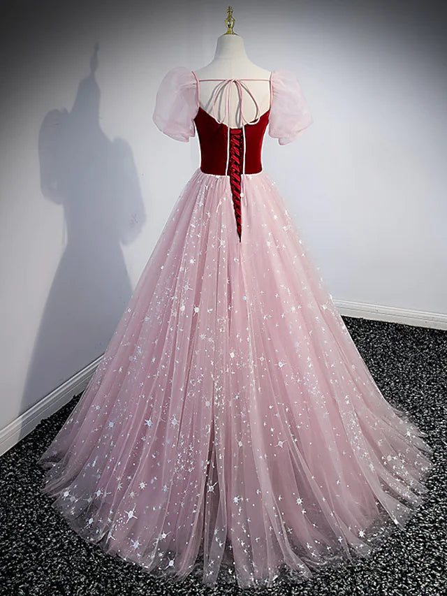 Model wearing a shimmering A-line prom gown.