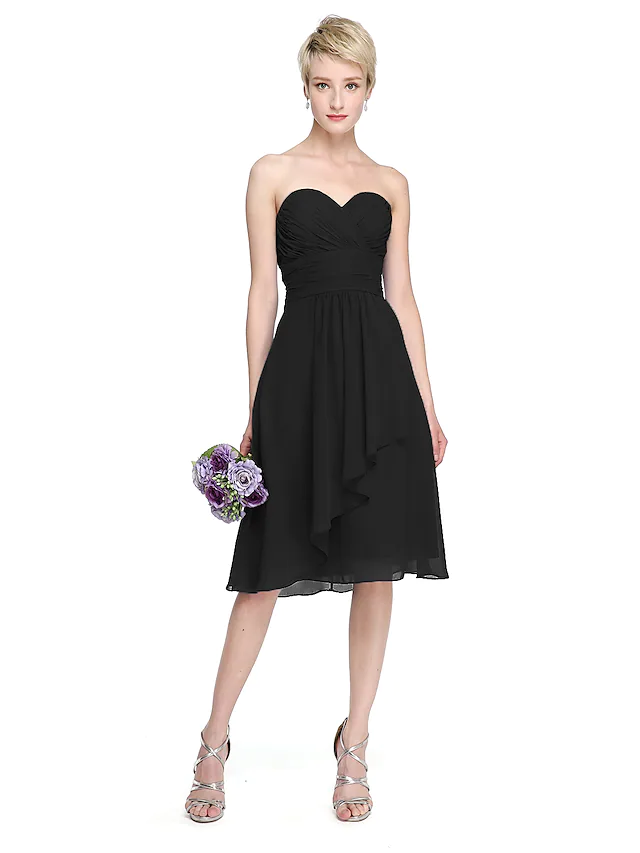 Back view of A-Line chiffon bridesmaid dress showing open back and criss cross detail.