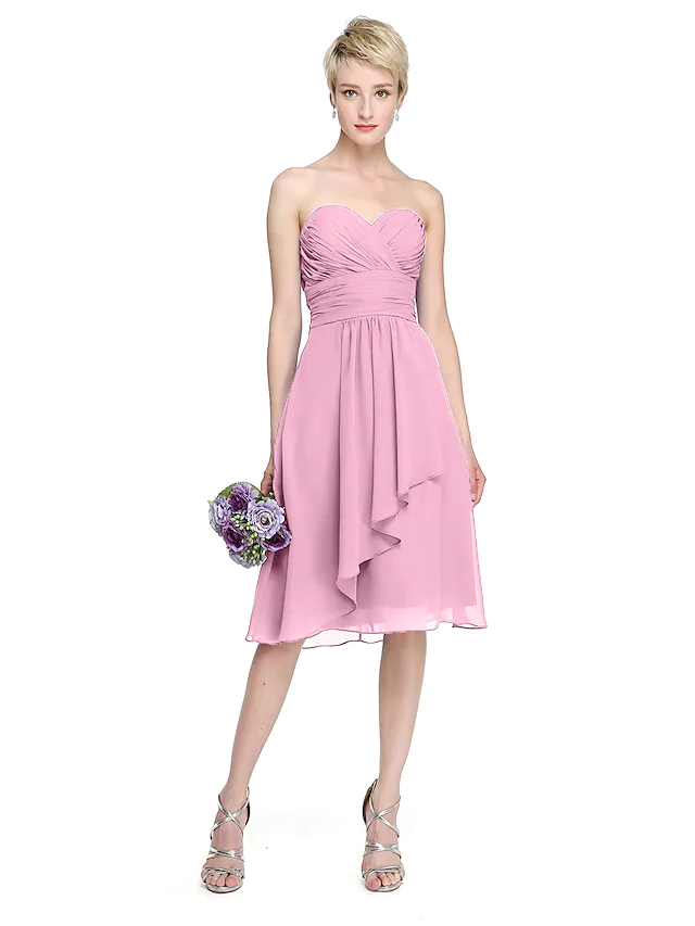 Close-up of ruched bodice and sweetheart neckline on chiffon bridesmaid dress.
