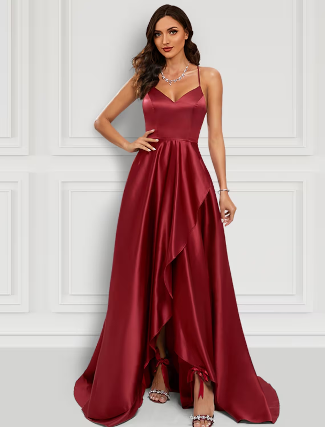 Elegant A-line charmeuse prom dress with spaghetti straps and ruffled slit.