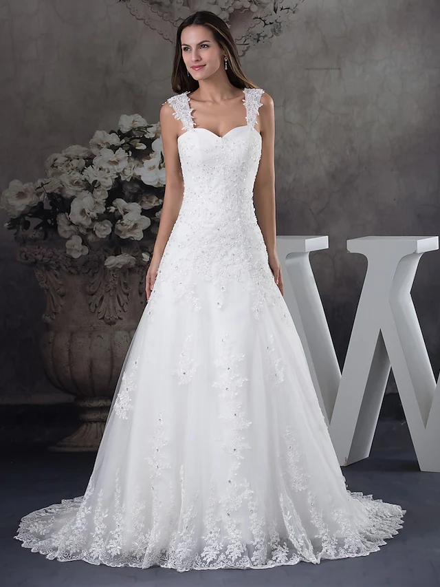 Elegant A-Line wedding dress with sweetheart neckline, spaghetti straps, lace, tulle, and beading appliques.