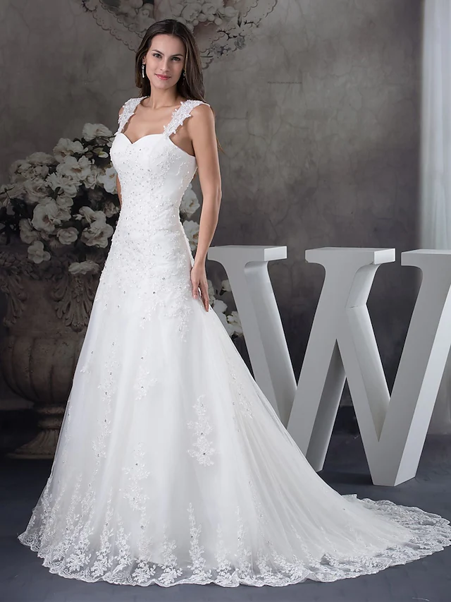 Elegant A-Line wedding dress with sweetheart neckline, spaghetti straps, lace, tulle, and beading appliques.