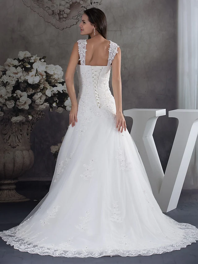 Elegant A-Line wedding dress with sweetheart neckline, spaghetti straps, lace, tulle, and beading appliques.
