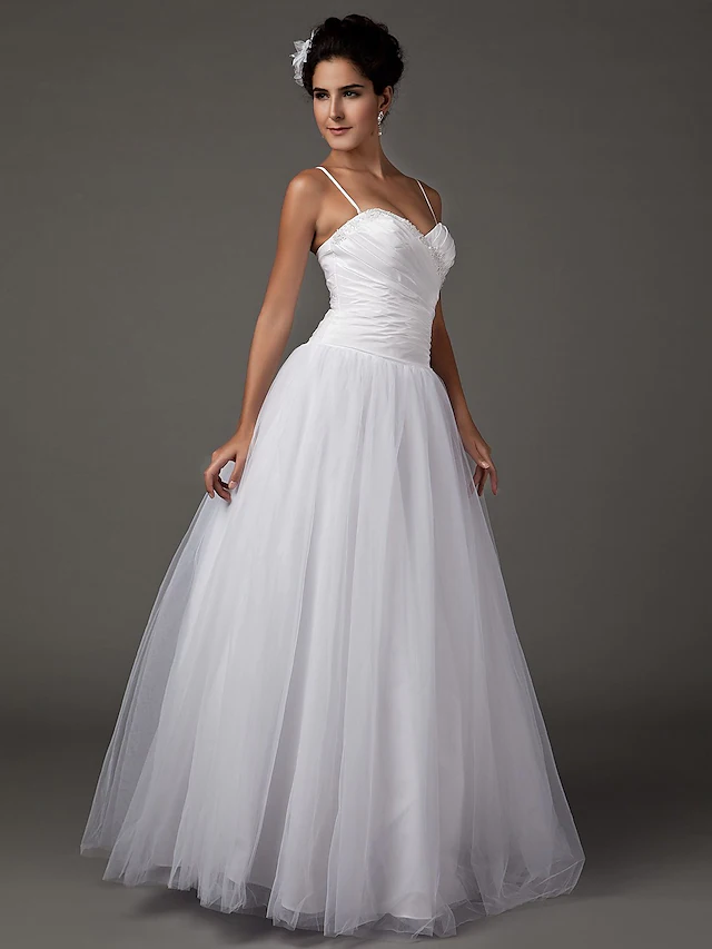 Side view of the A-Line wedding dress, showing floor-length skirt.