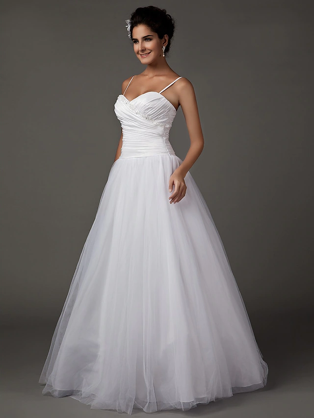 Back view of the A-Line wedding dress with delicate spaghetti straps.