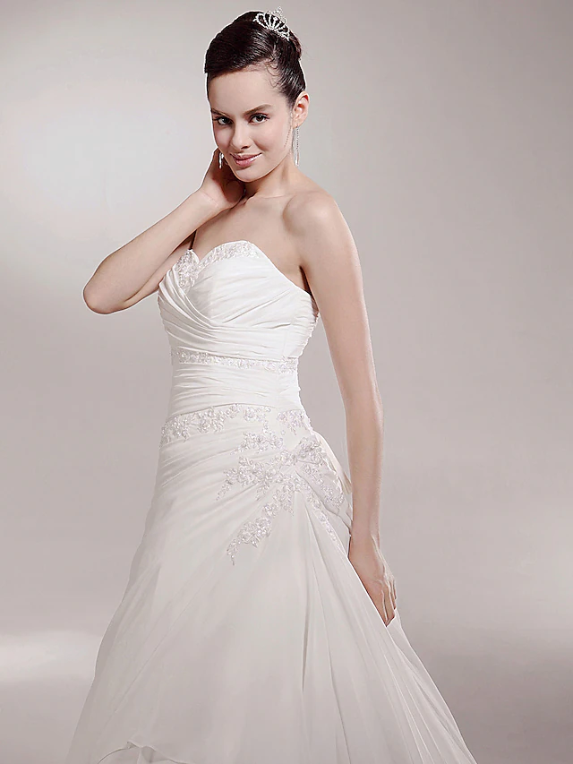 Full length view of a princess A-line wedding dress.