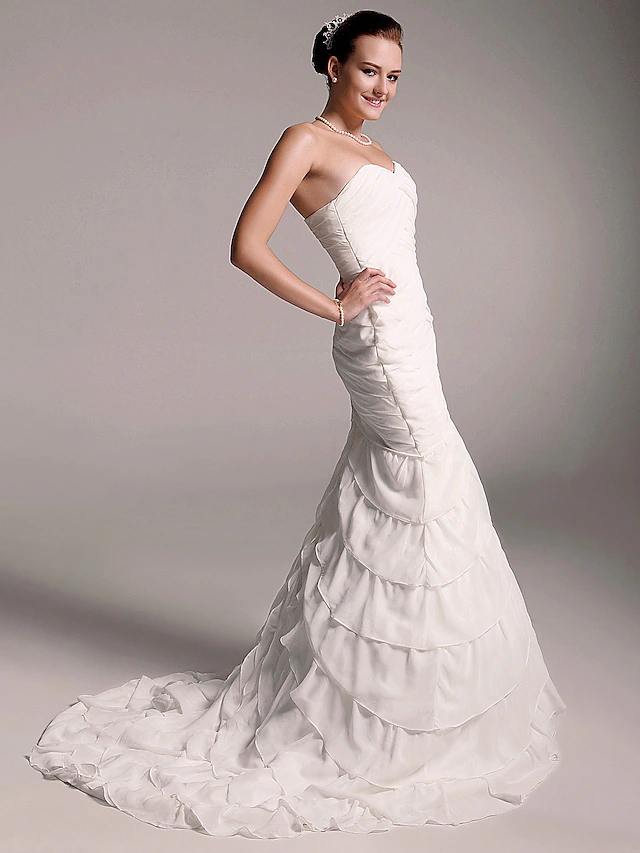 Back view of strapless chiffon A-Line wedding dress.