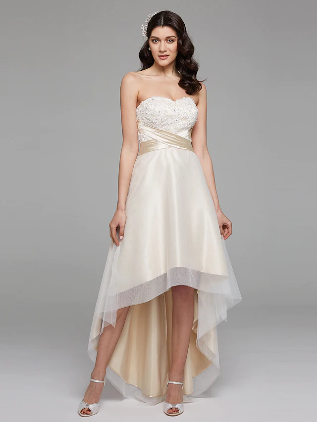 Elegant A-Line wedding dress with sweetheart neckline and floral lace details.
