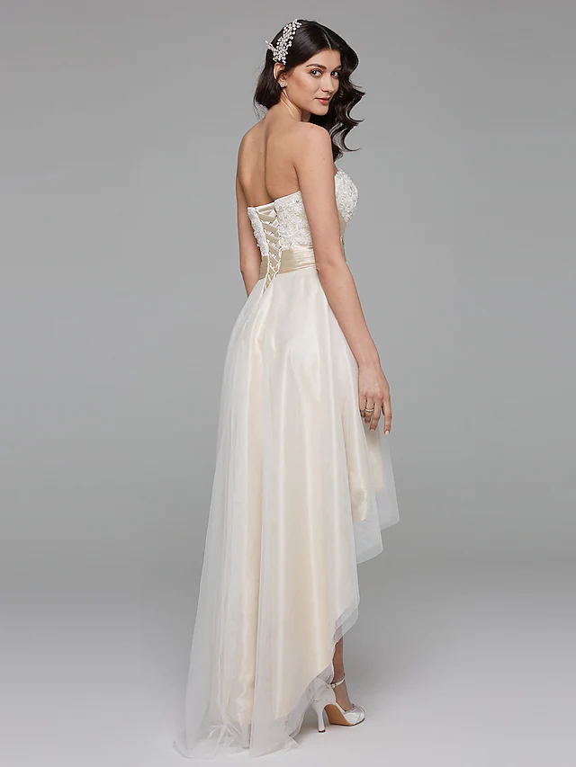 Back view of A-Line wedding dress showing bowknot sash and train.