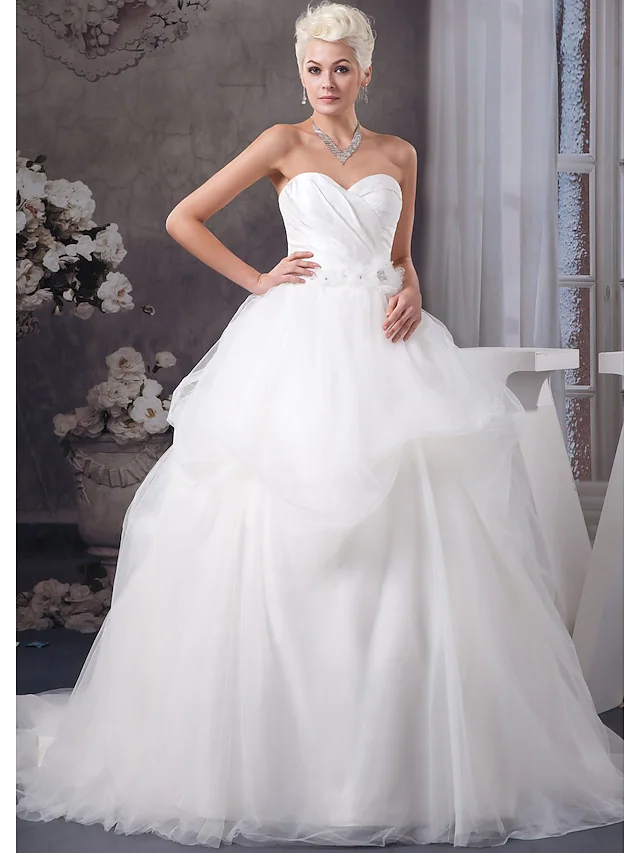 A-Line wedding dress with sweetheart neckline and ruched bodice.