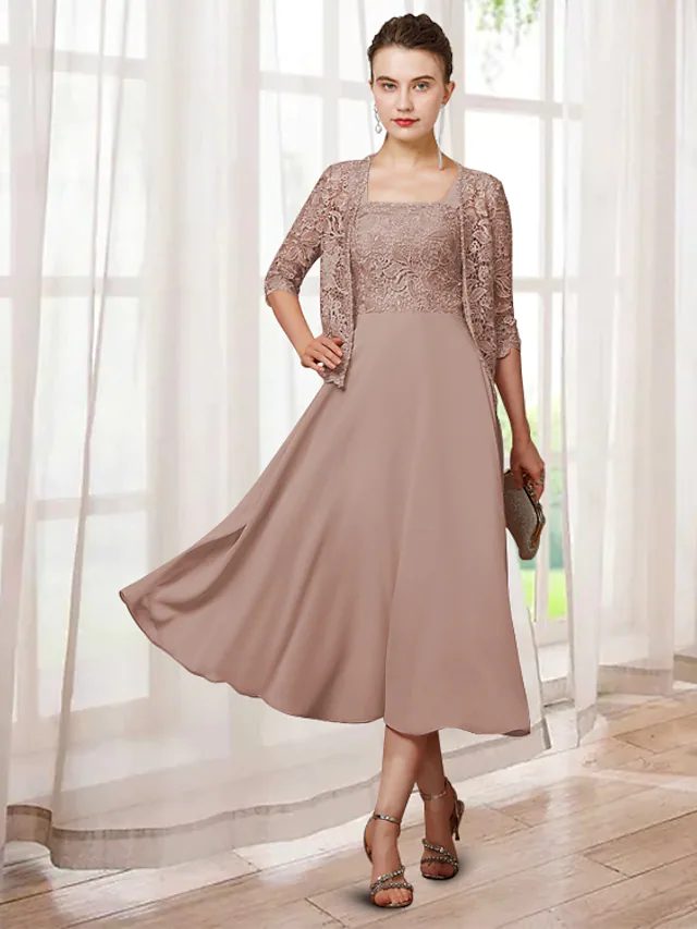 Elegant two-piece A-line mother of the bride dress with jewel neck, tea length, and half sleeves.