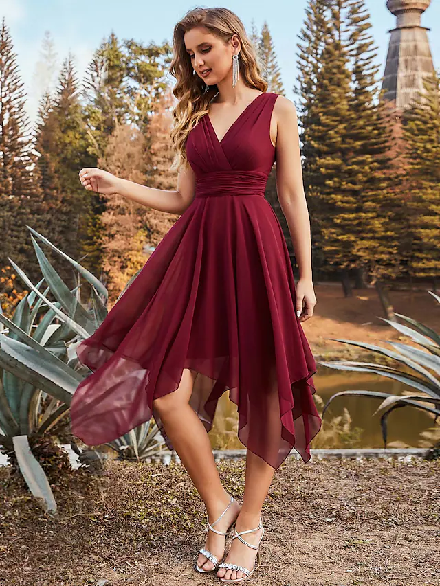 Close-up of the V-neckline and ruched detail on a chiffon bridesmaid dress.