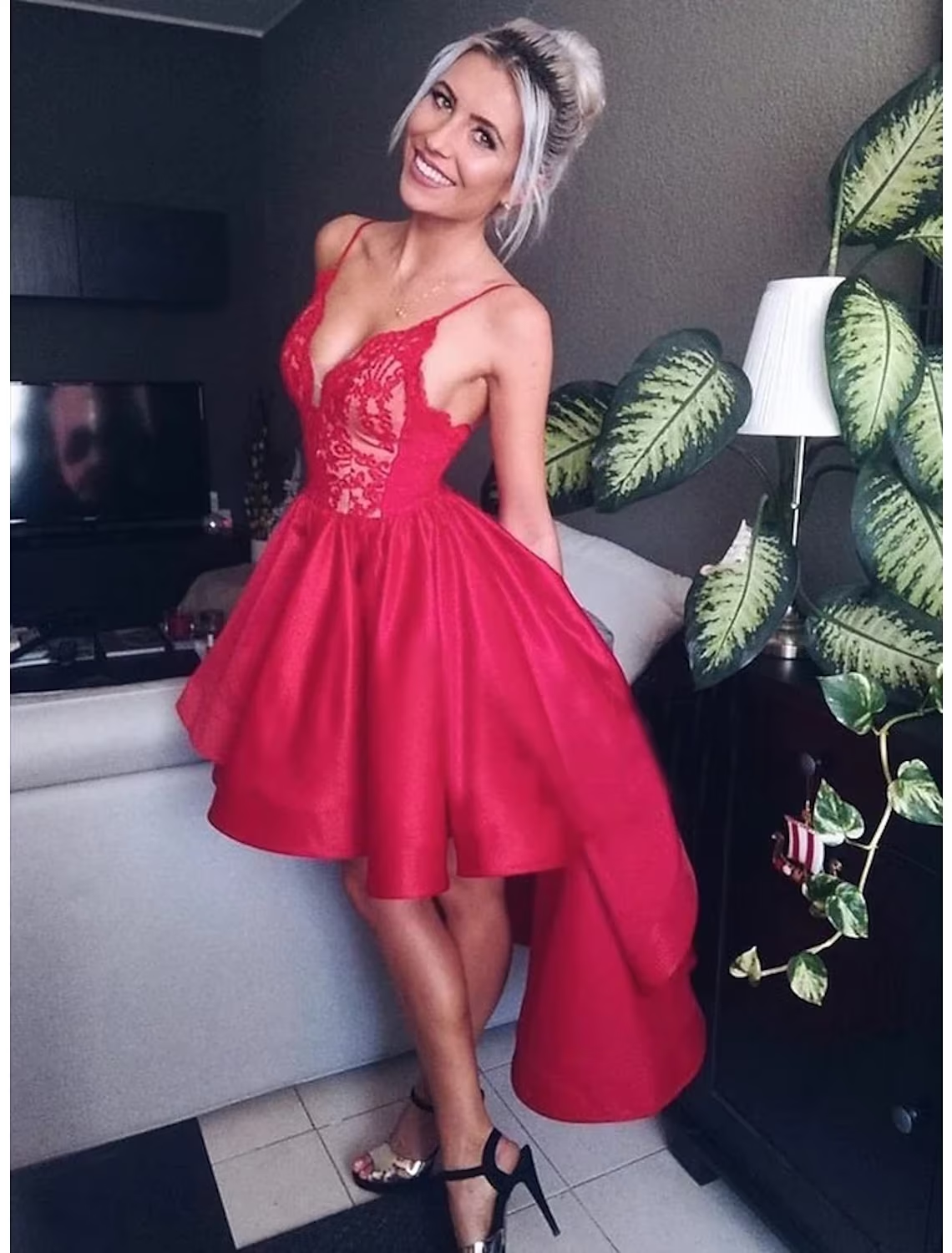 Elegant A-line satin prom dress with V-neck and asymmetrical pleated skirt.