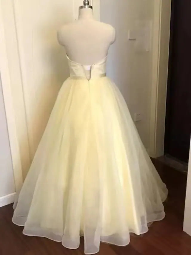 Floor length sparkling A-Line dress for wedding guests.