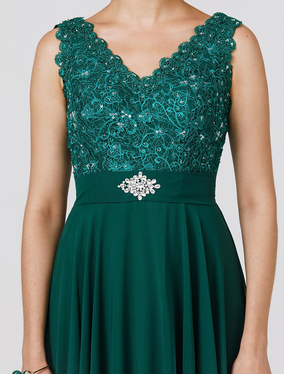 Side view of floor-length sleeveless chiffon dress.