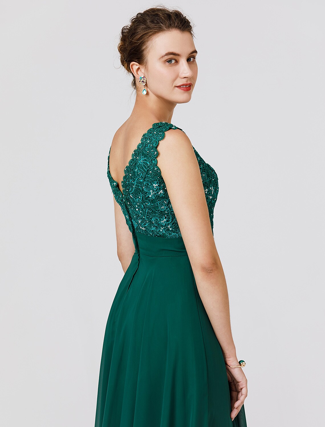 Close-up of beaded detail and sash on chiffon gown.