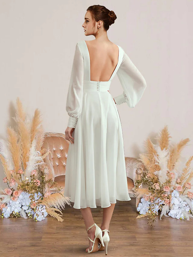 Back view of a graceful A-Line V-neck chiffon wedding dress with long sleeves.